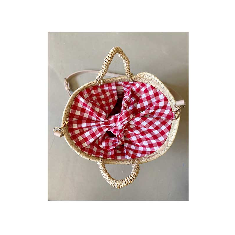small straw basket with red cotton gingham by maud fourier paris