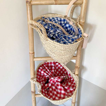 small straw basket lined with red cotton gingham by maud fourier paris