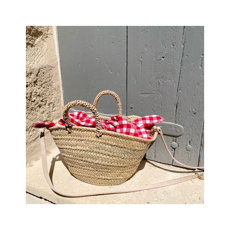 small straw basket lined with red cotton gingham by maud fourier paris