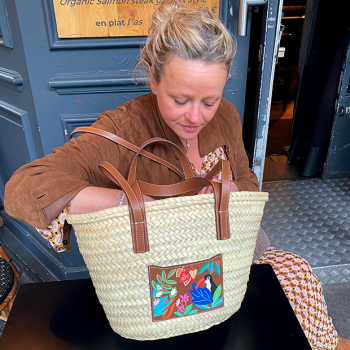 Toucan woven palm leaf basket with shoulder handles