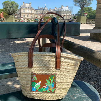 Hand-painted cockatoo motif on leather pocket