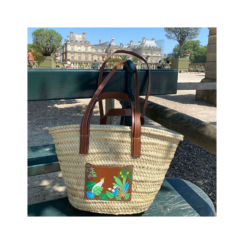 Hand-painted cockatoo motif on leather pocket