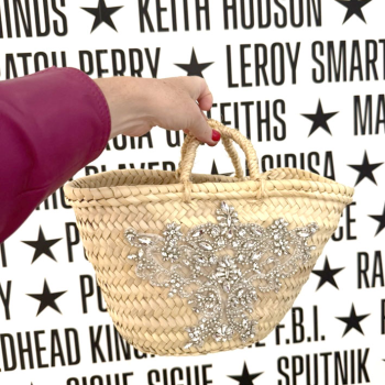 Generous rhinestone embroidery on a mini straw basket