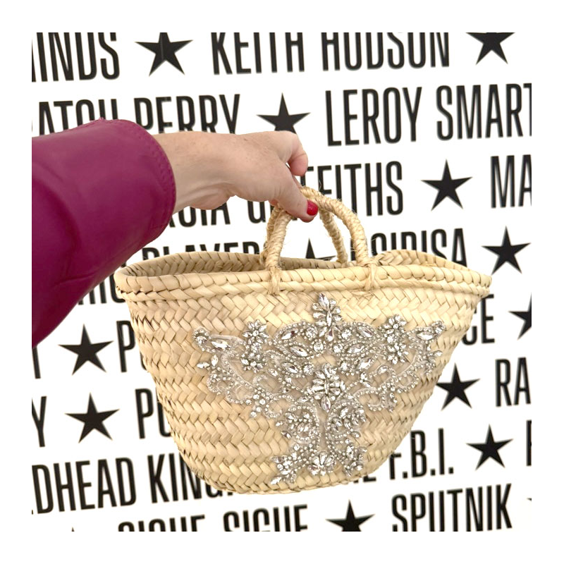 Generous rhinestone embroidery on a mini straw basket