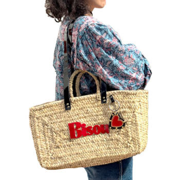 Straw basket with black leather shoulder handles