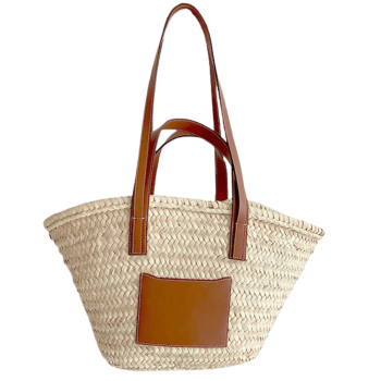 Straw basket with camel leather handles worn on the shoulder
