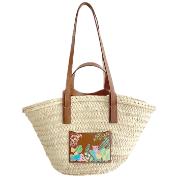 pink leopard straw basket worn on the shoulder with leather handles