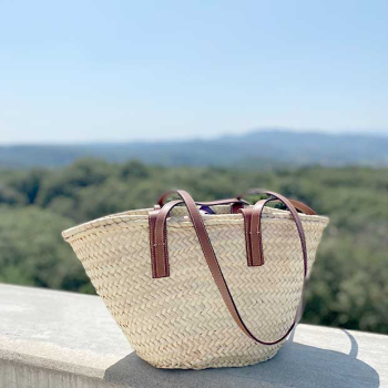 Handwoven palm leaf basket with pink leopard leather detail